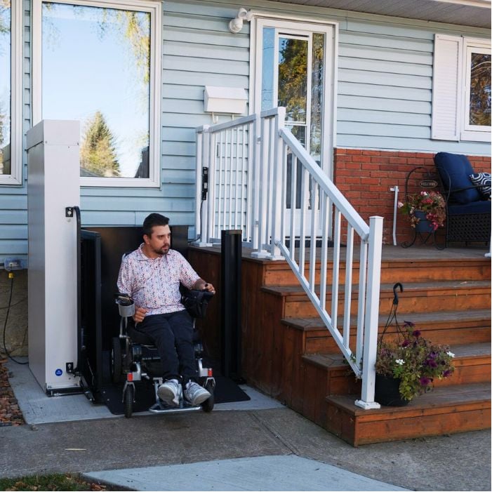 man in wheelchair on porch lift